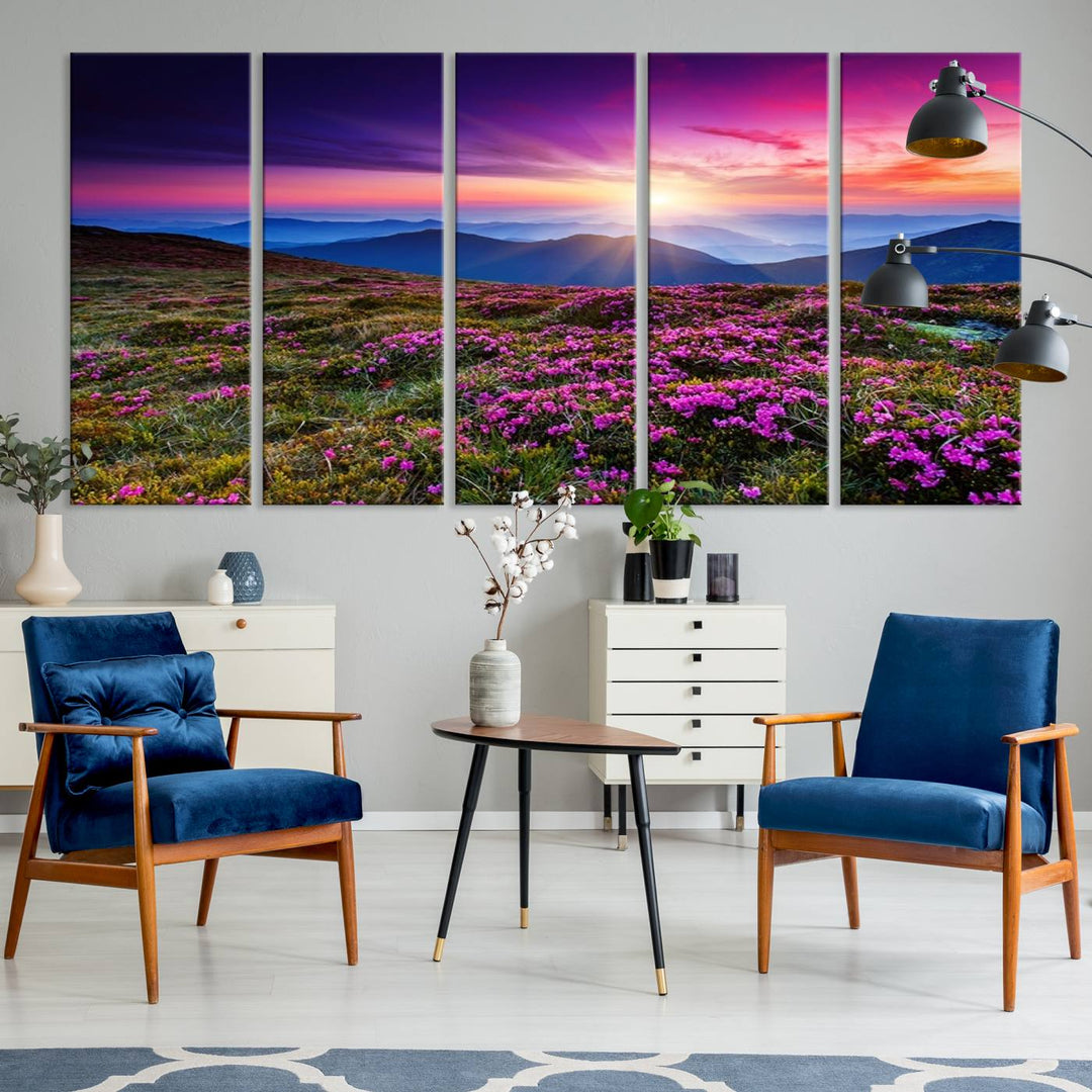 A 3-panel landscape photography canvas of a sunset over mountain meadows with purple wildflowers decorates the wall.