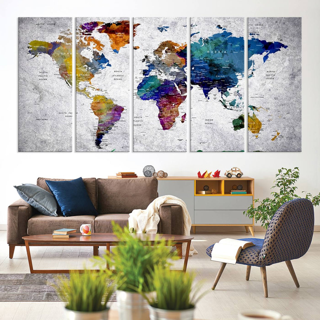 The World Map Art Canvas Print, featuring country names on a grunge-stained gray background, is perfect for stylish home decor.