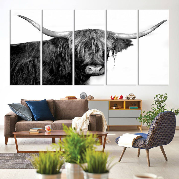 The Black and White Highland Cow Multi Panel Wall Art Canvas Print with UV-protection hangs prominently.