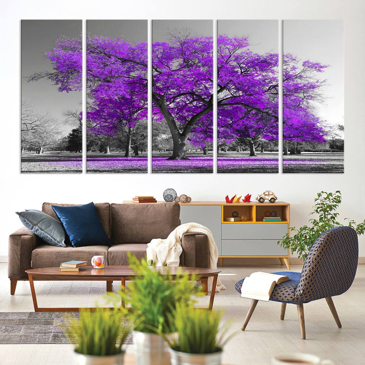 The Big Purple Tree Wall Art Canvas Print showcases a vibrant purple tree set against a black-and-white landscape.