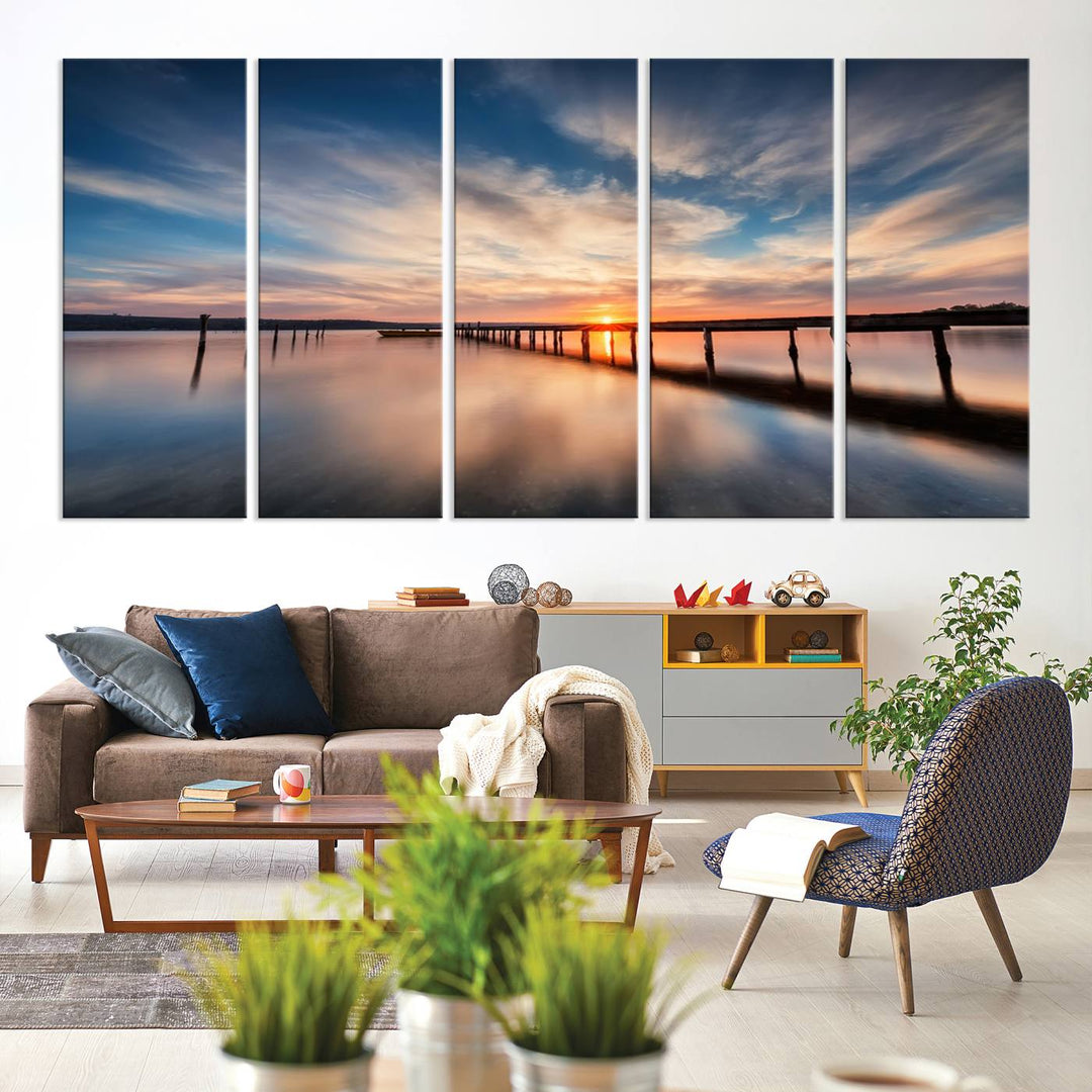 The Sunset Pier Canvas features a serene coastal landscape with vibrant hues under cloudy skies, ideal for modern decor.