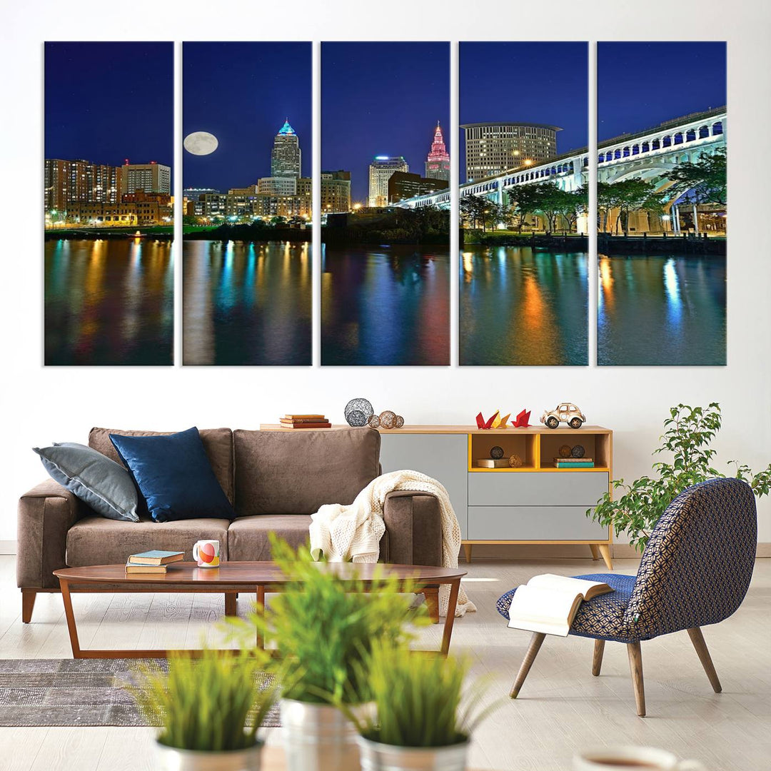 Cleveland City Lights Night Skyline Wall Art canvas showcases a moonlit cityscape reflected on water.