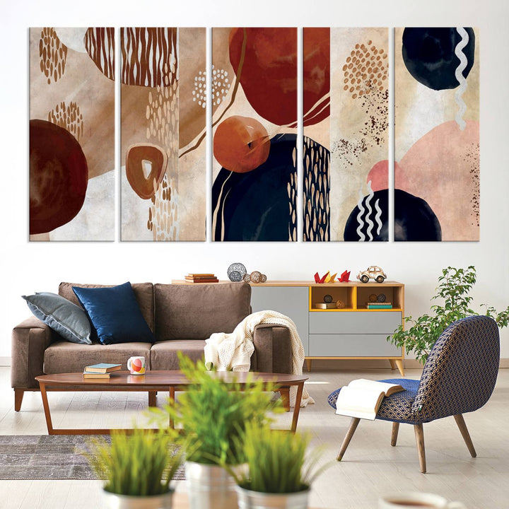 The Boho Neutral Canvas Print Set with earthy tones and circles hangs on the wall.