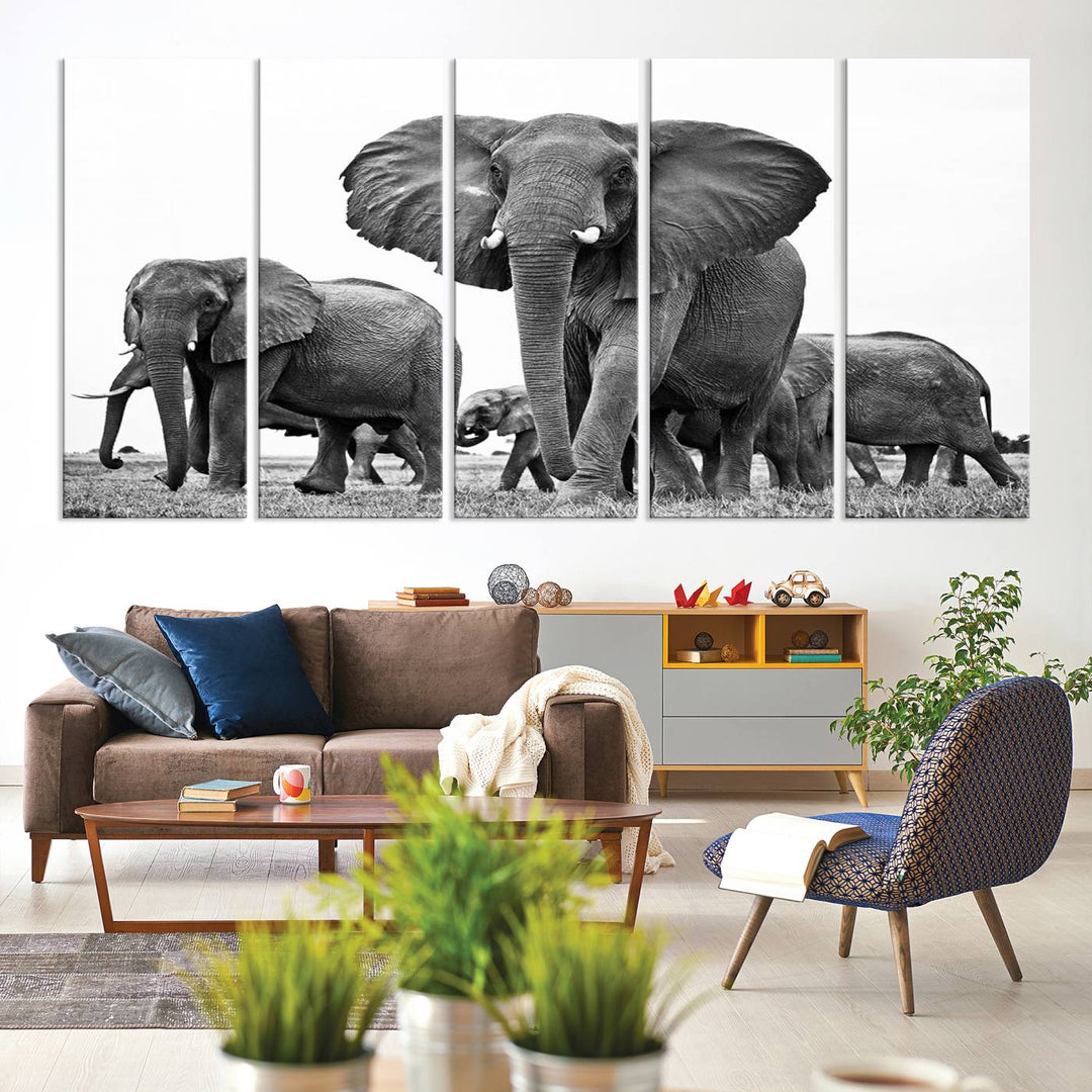 A modern dining area features a Black White Elephant Family Wall Art Canvas Print.