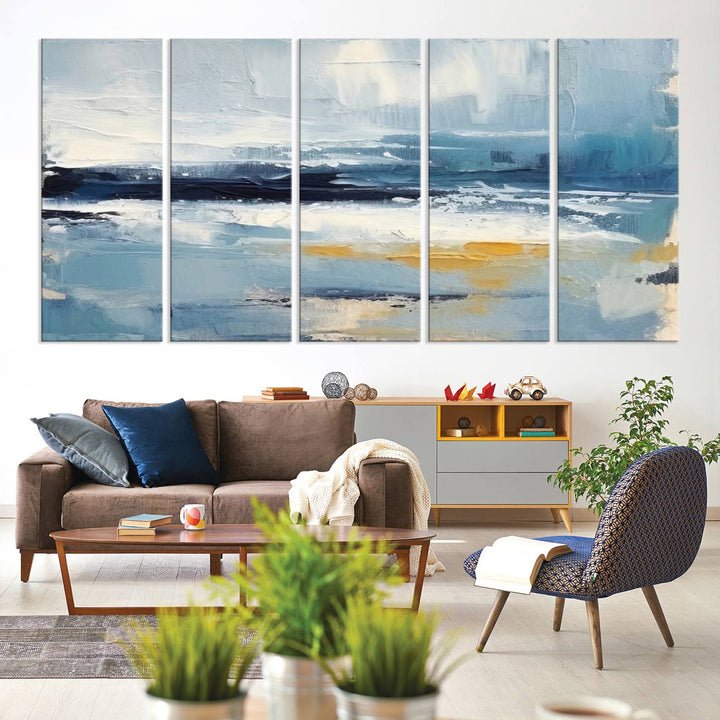 The Abstract Ocean Canvas Wall Art in coastal blue and gold enhances the modern kitchen.