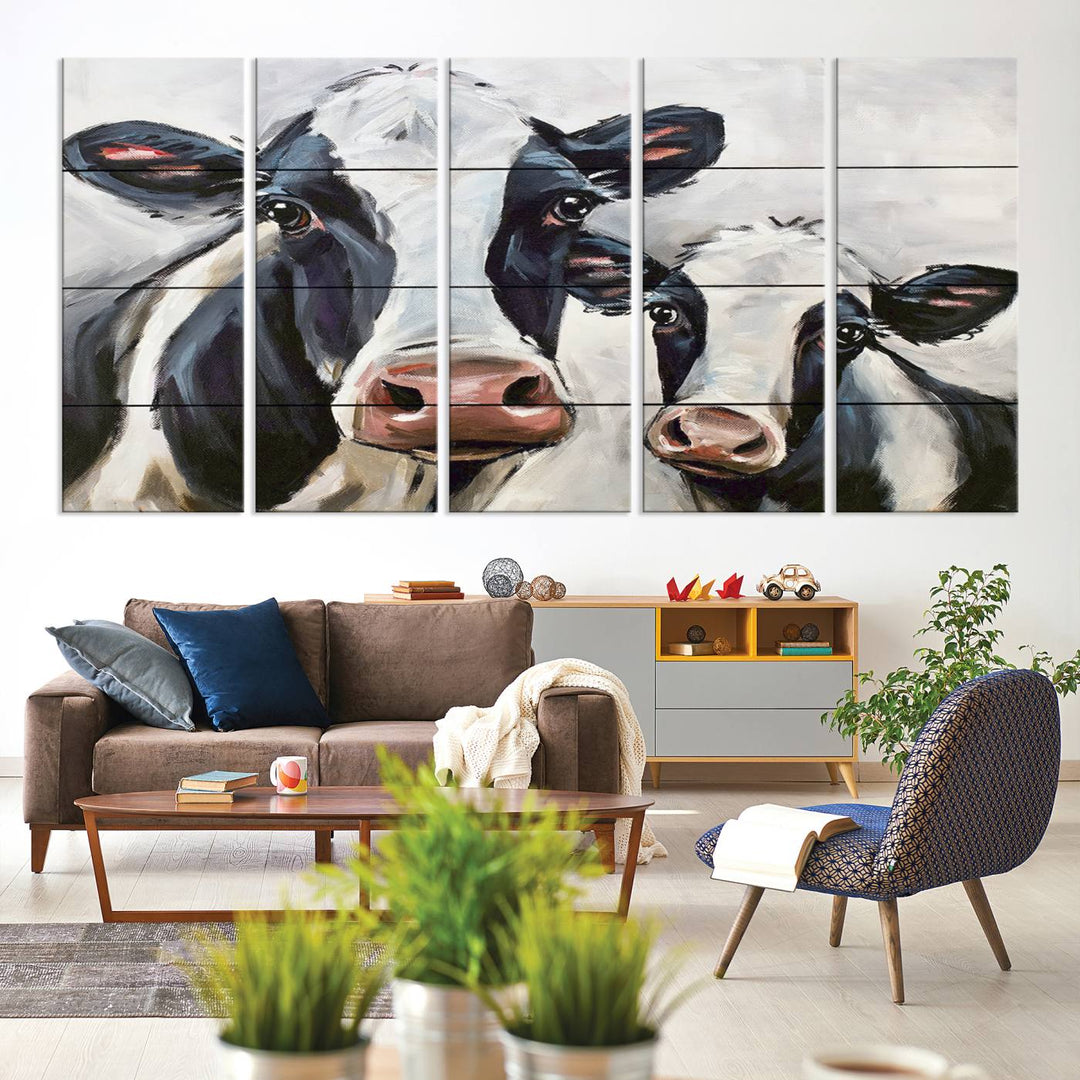 The Vintage Baby and Mom Cattle Canvas, featuring cows with black and white patches, is a prominent piece of wall art.