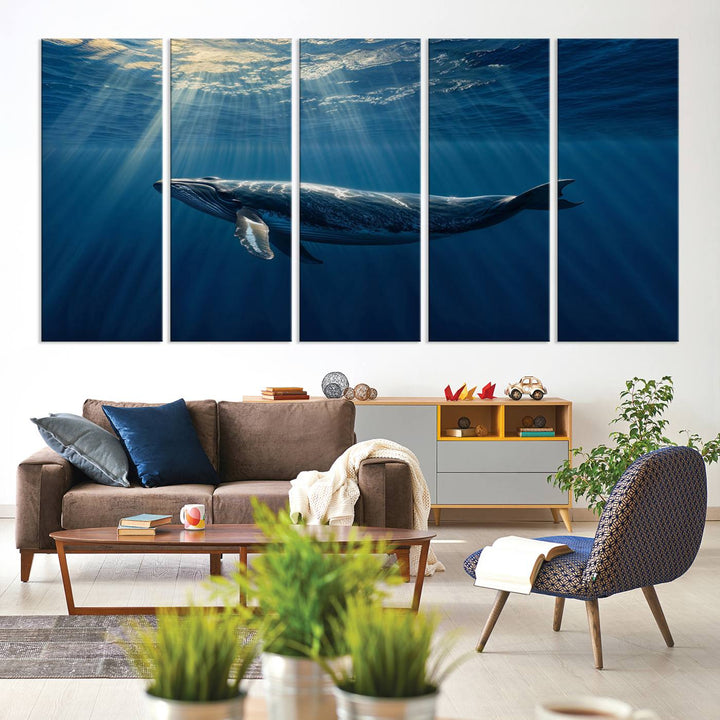 The Whale under Ocean wall art canvas print graces the white wall.