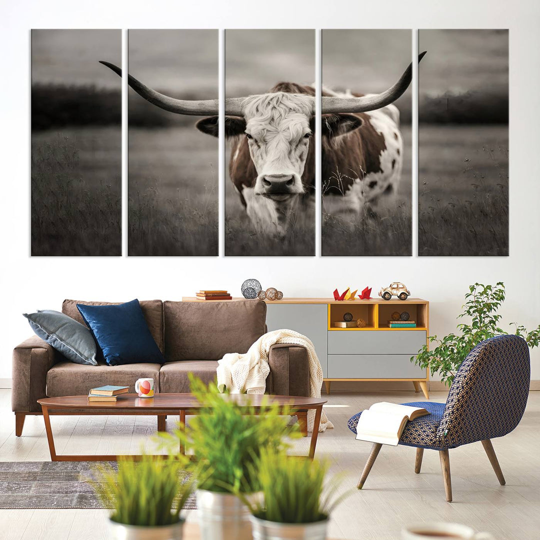 The Texas Longhorn Cow Canvas Wall Art Print adds a rustic touch to a living room.