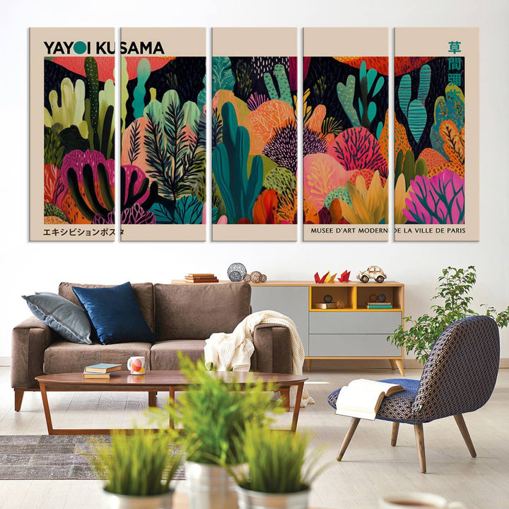 The vibrant canvas print of wall art features abstract plants, with the elegant text "Yayoi Kusama Wall Art Canvas Print" displayed on the colorful frame.