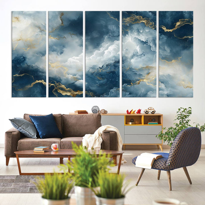 Modern living room featuring the Large Abstract Print - Luxe Blue and Gold Abstract Canvas Wall Art that showcases a bold cloudscape, perfect for modern home decor.