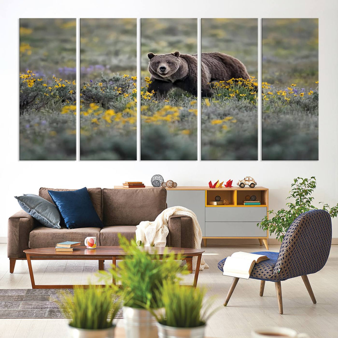 The "Grizzly 399 in Wild Flowers Wall Art Canvas Print" features a grizzly bear strolling through a field of yellow and purple flowers, beautifully showcased as a triptych. This handcrafted piece, proudly made in the USA, adds charm and sophistication to your space.