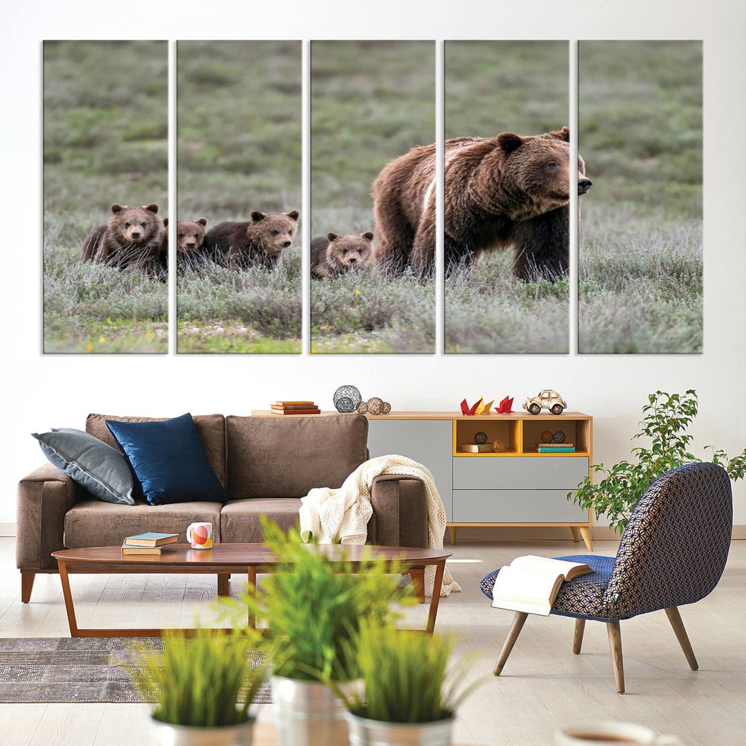 The large canvas print titled "Queen of the Tetons, 399 Grizzly Bear Cubs" showcases majestic wildlife photography of a bear and her cubs walking through the grass. This stunning canvas wall art, handmade in the USA, adds a charming touch to any room with its rustic decor appeal.