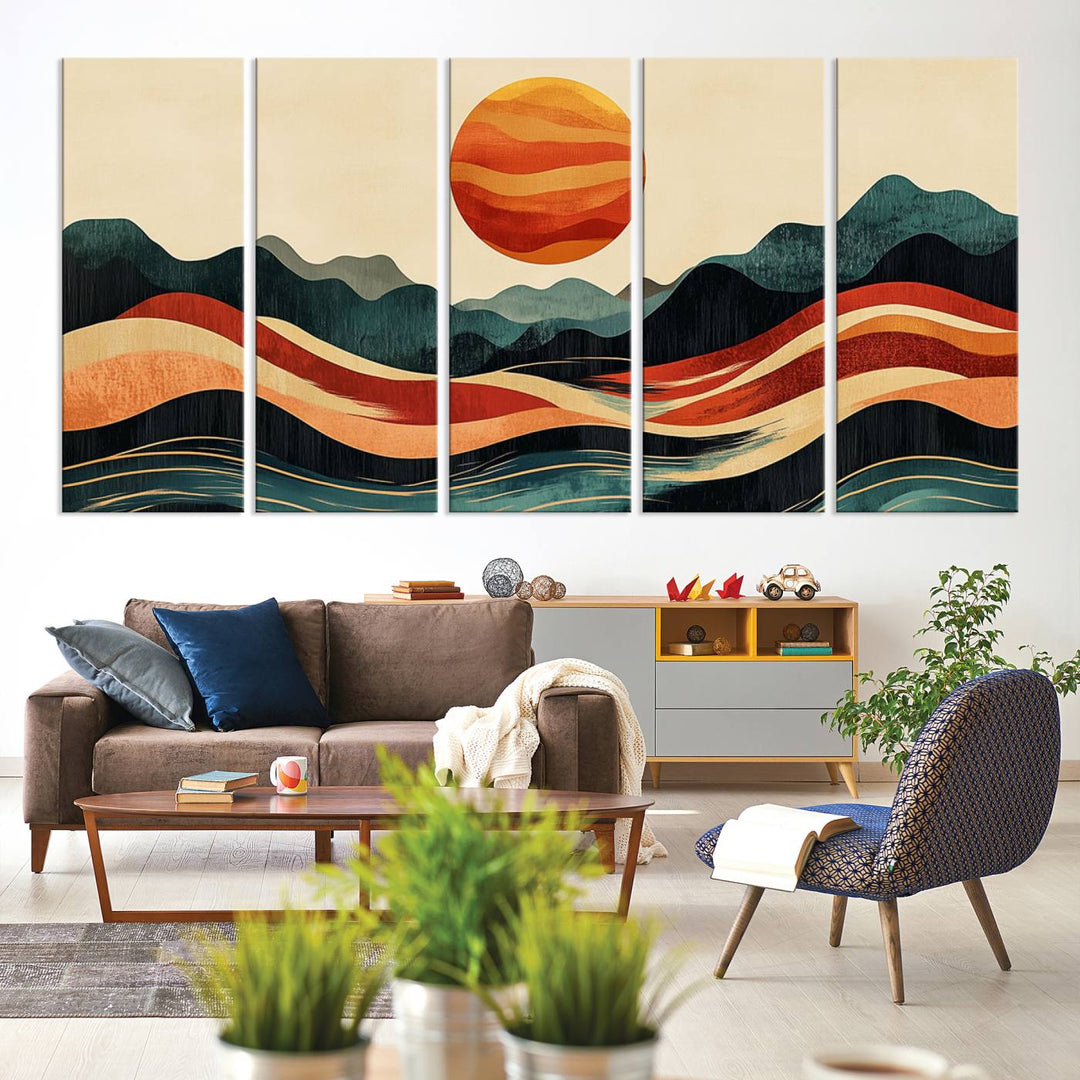 The Mountain Triptych wall art, featuring a design of the sun, mountains, and waves, is displayed prominently on the wall.