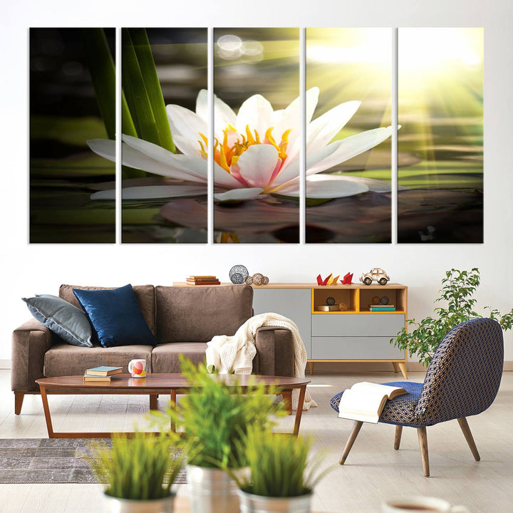 The Lotus Flower Wall Art Canvas Print showcases a white water lily with a yellow center floating gracefully in sunlight.