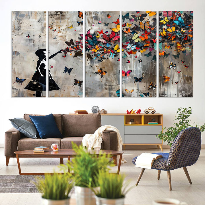 The Banksy Butterfly Girl 3-Piece Modern Graffiti Canvas Wall Art features a silhouette of a girl reaching for butterflies.