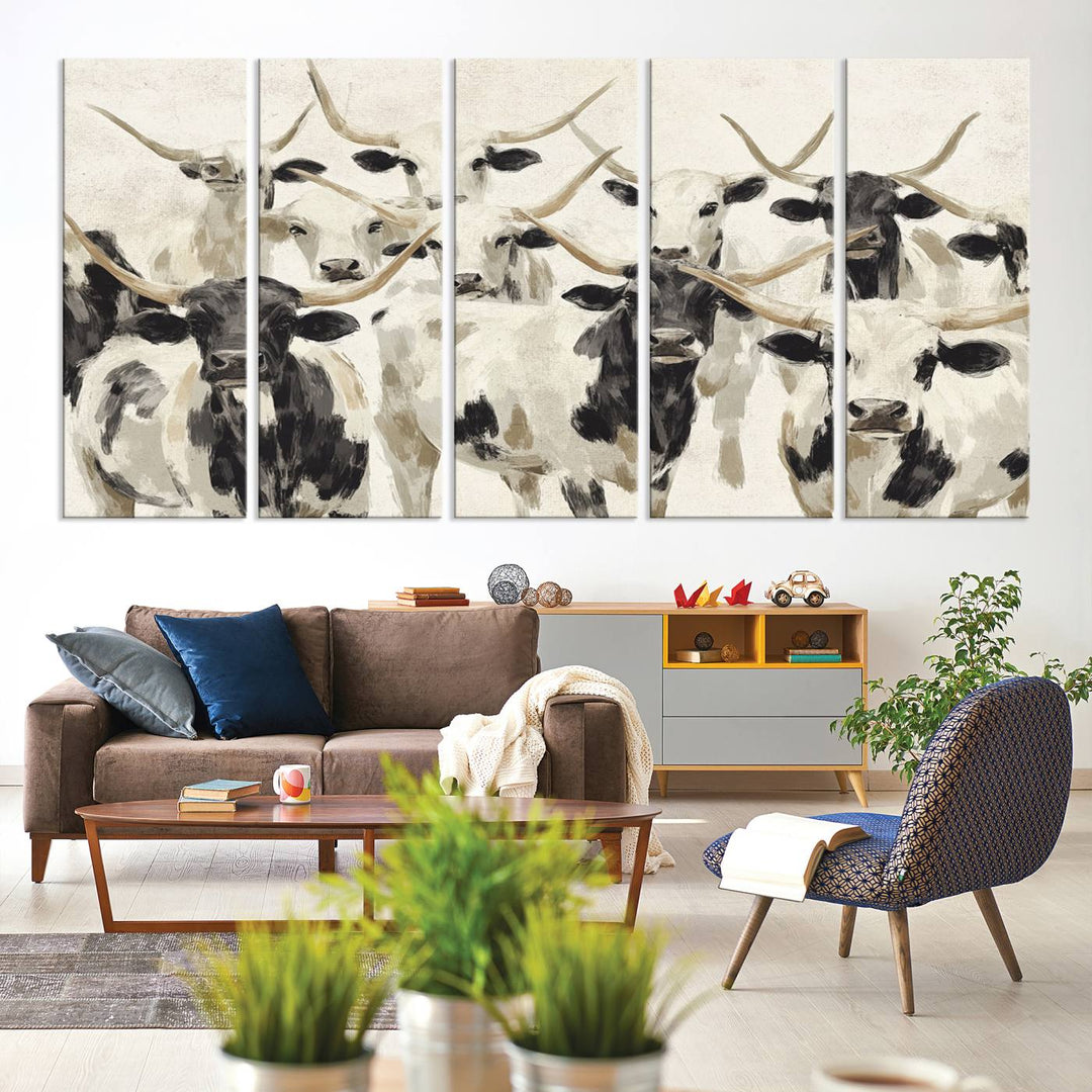 Canvas print titled Longhorn Texas Cow Drawing, depicting longhorn cattle with black and white markings, made in the USA, displayed on the wall.