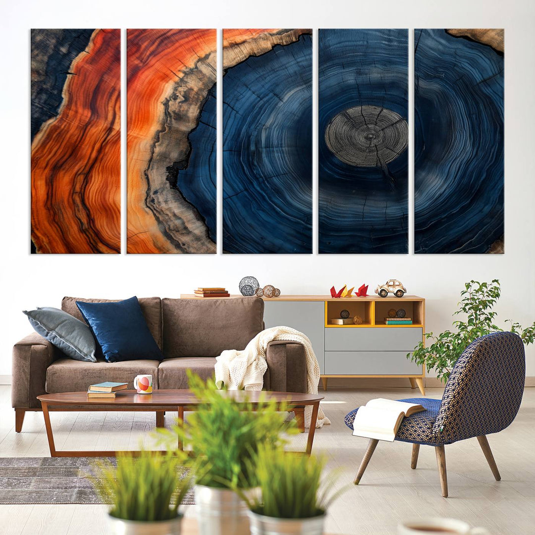 Abstract Tree Ring Wall Art Print on canvas featuring vibrant blue, orange, and brown rings with a natural rustic wood texture. Free shipping available!.