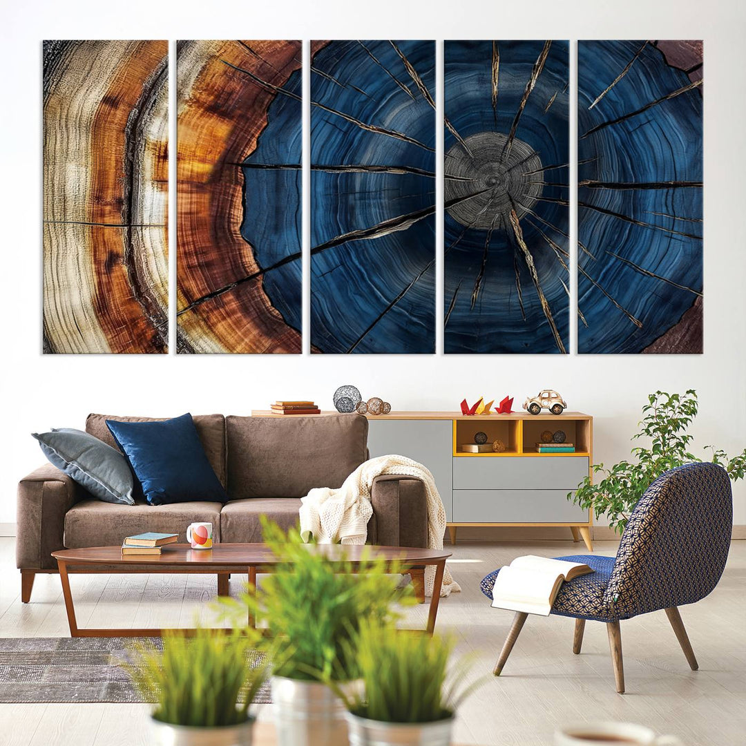 The Abstract Tree Rings Canvas Print features blue, brown, and orange rings that highlight wood grain and natures beauty.