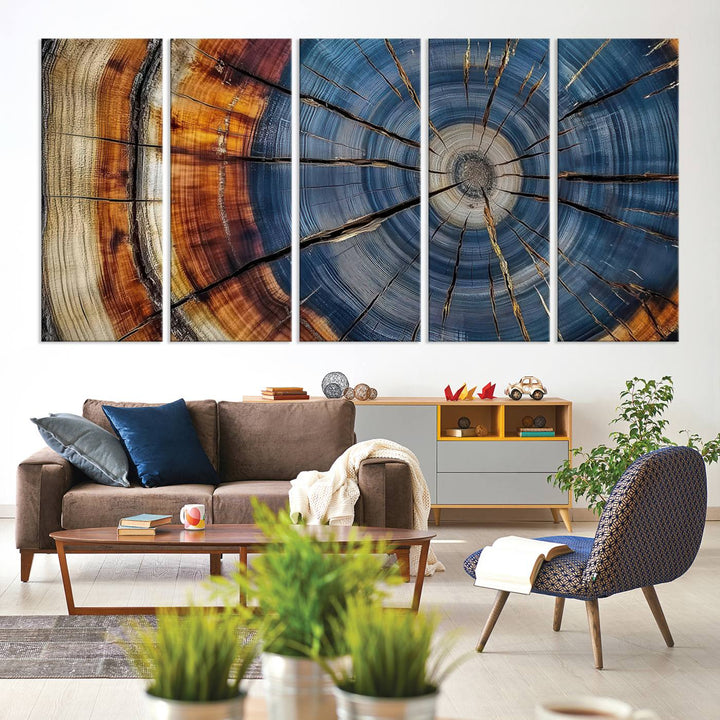 Close-up of blue, brown, and orange wood grain rings on the Abstract Tree Rings Canvas Wall Art Print.