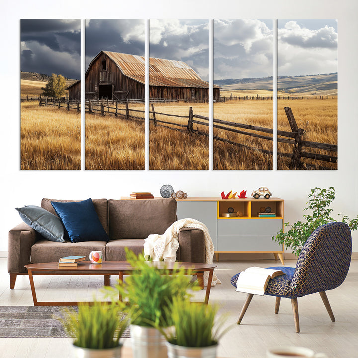 Canvas of a weathered wooden barn in a golden field under a dramatic sky, perfect for rustic or farmhouse-style wall decor.