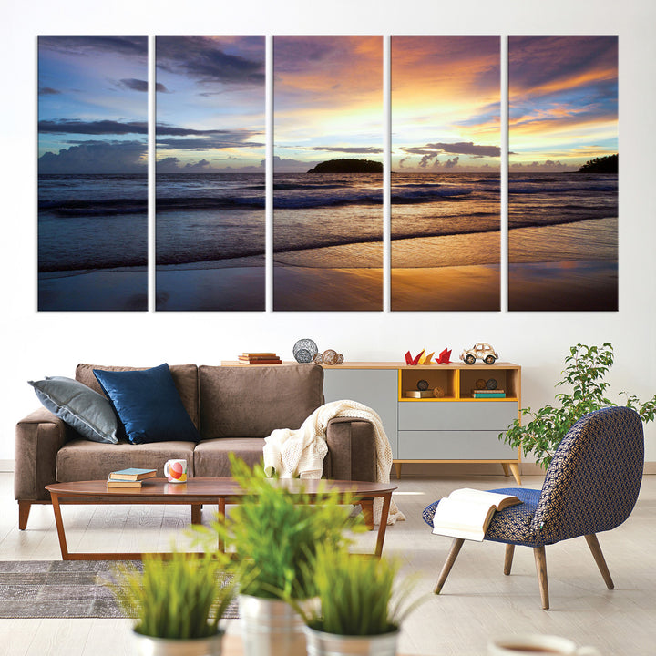 A tropical beach at sunset with waves gently washing ashore, reflecting golden and purple hues in the sky, creating a tranquil coastal scene.