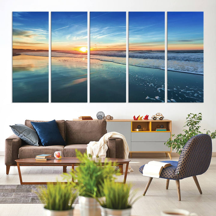 The Blue Sky and Beach Wall Art Canvas Print features a vibrant orange sky reflecting on wet sand.