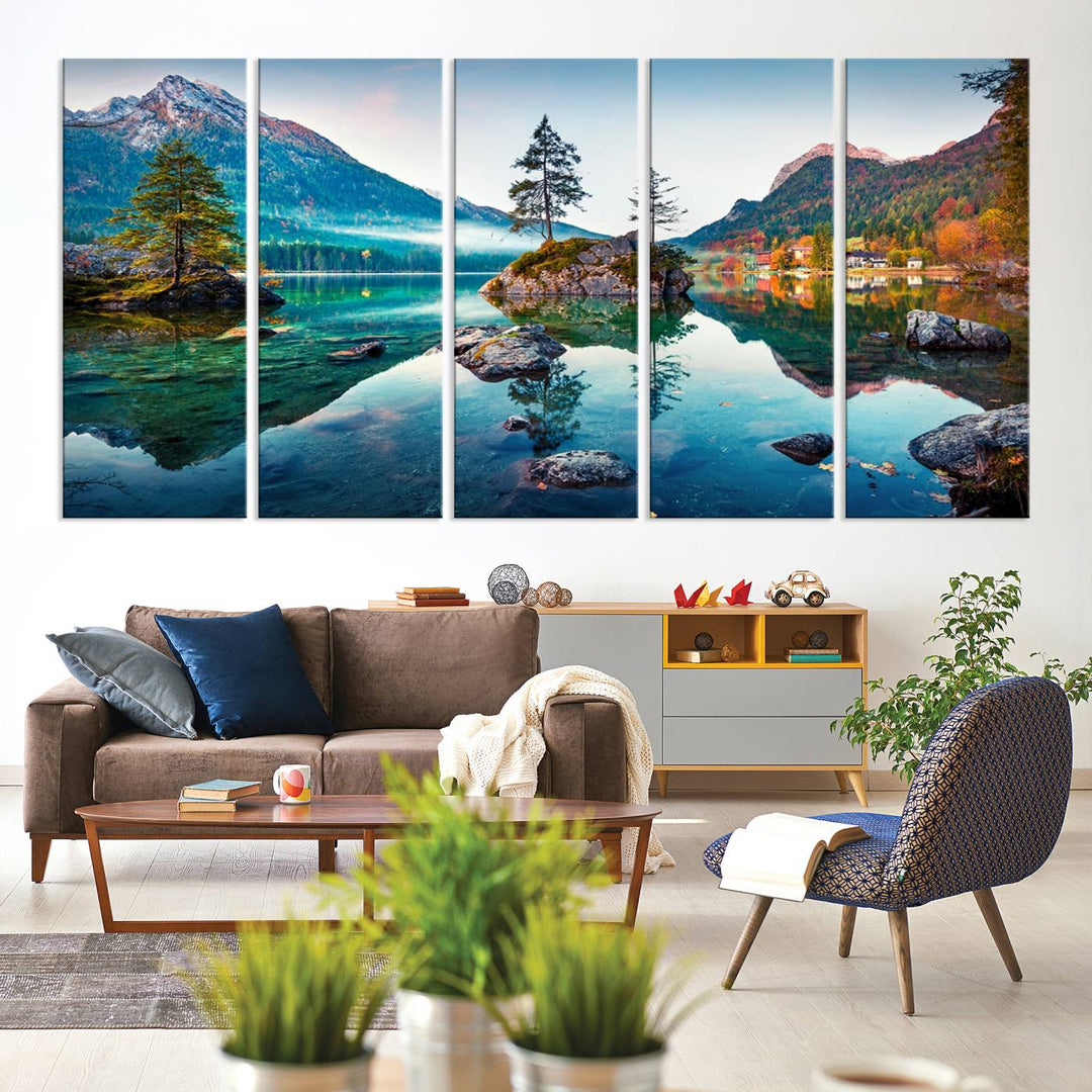 The 3-panel wall art showcases a serene mountain lake with rocky islands and trees, creating an ideal focal point for dining rooms or offices.