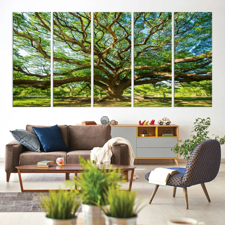 The Angel Oak Tree Wall Art, a multi-panel canvas print showcasing a large tree with sprawling branches and green leaves in a style reminiscent of the majestic Angel Oak Tree, elegantly adorns the wooden wall in the living room.