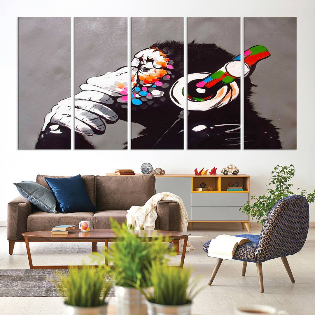 A vibrant triptych, the "DJ Monkey Listening to Music" wall art print, features a Banksy-inspired large canvas adorned with colorful modern pop art. This striking piece elegantly enhances the room with its dynamic and lively depiction.