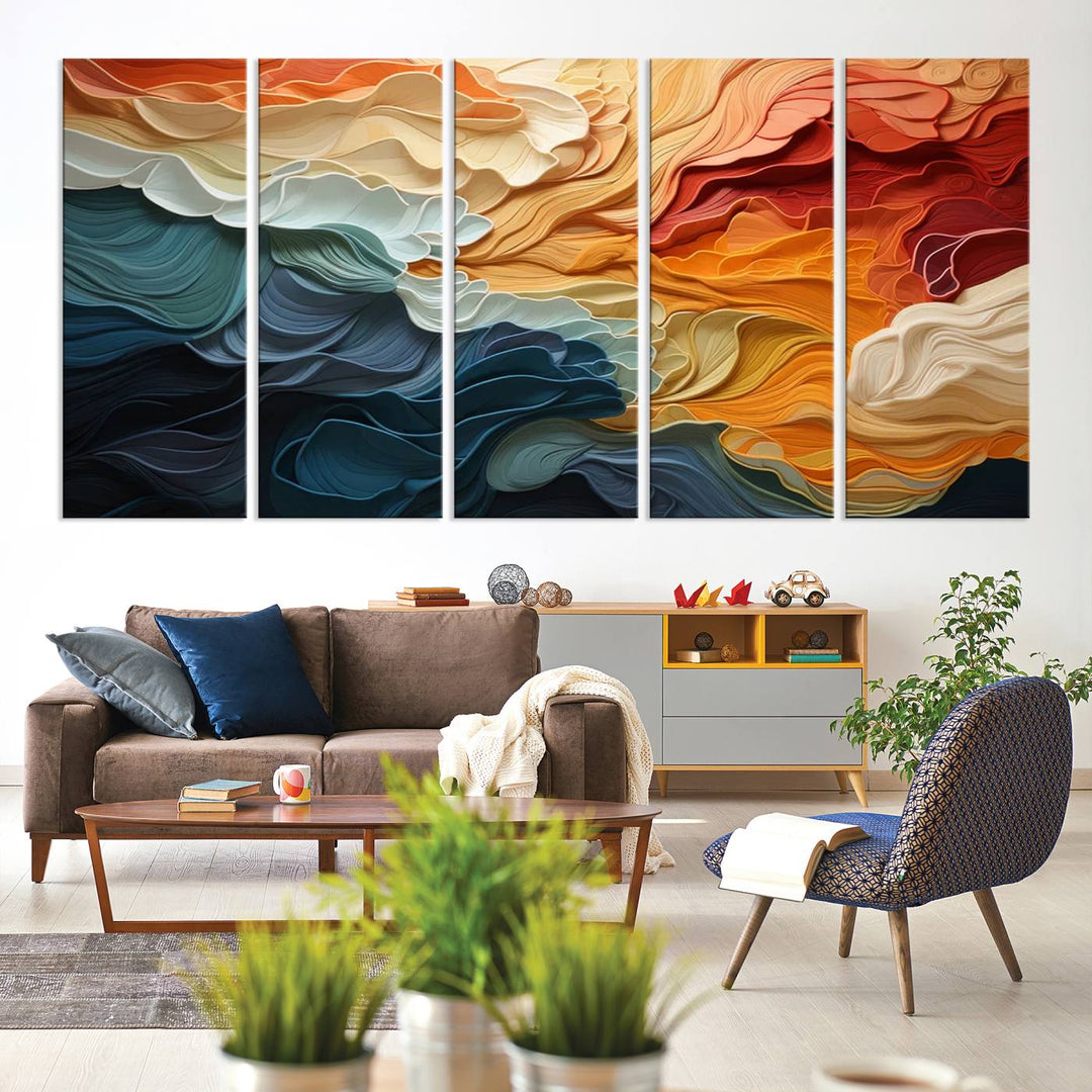 A Blue Orange Abstract Wave Wall Art Canvas Print adorns the wall. This colorful masterpiece is professionally hand-assembled to enhance any space.