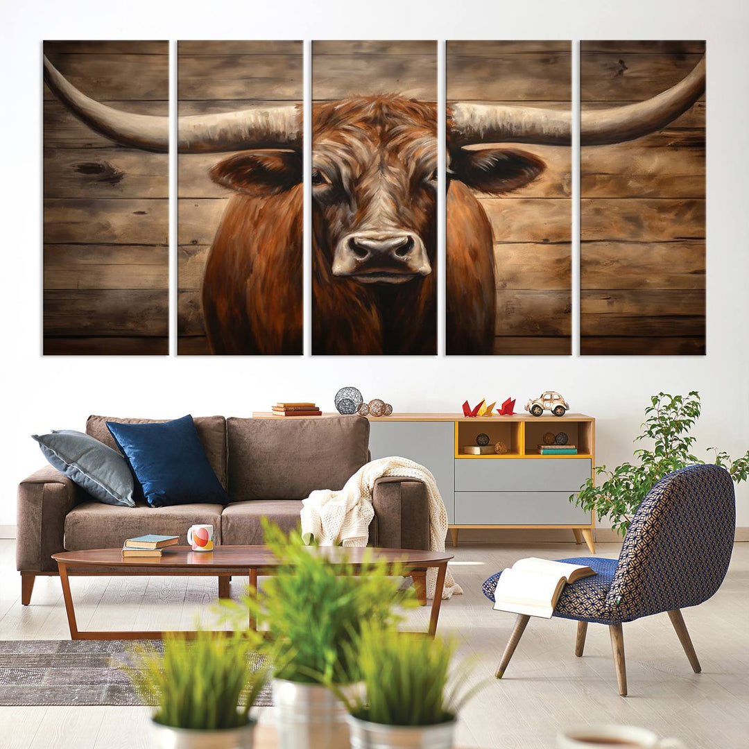 The Longhorn Bull Wall Art, a ready-to-hang canvas print, showcases an image of a brown longhorn cow set against a wooden background, perfect for those looking to enhance their space with rustic farmhouse and western barn decor.