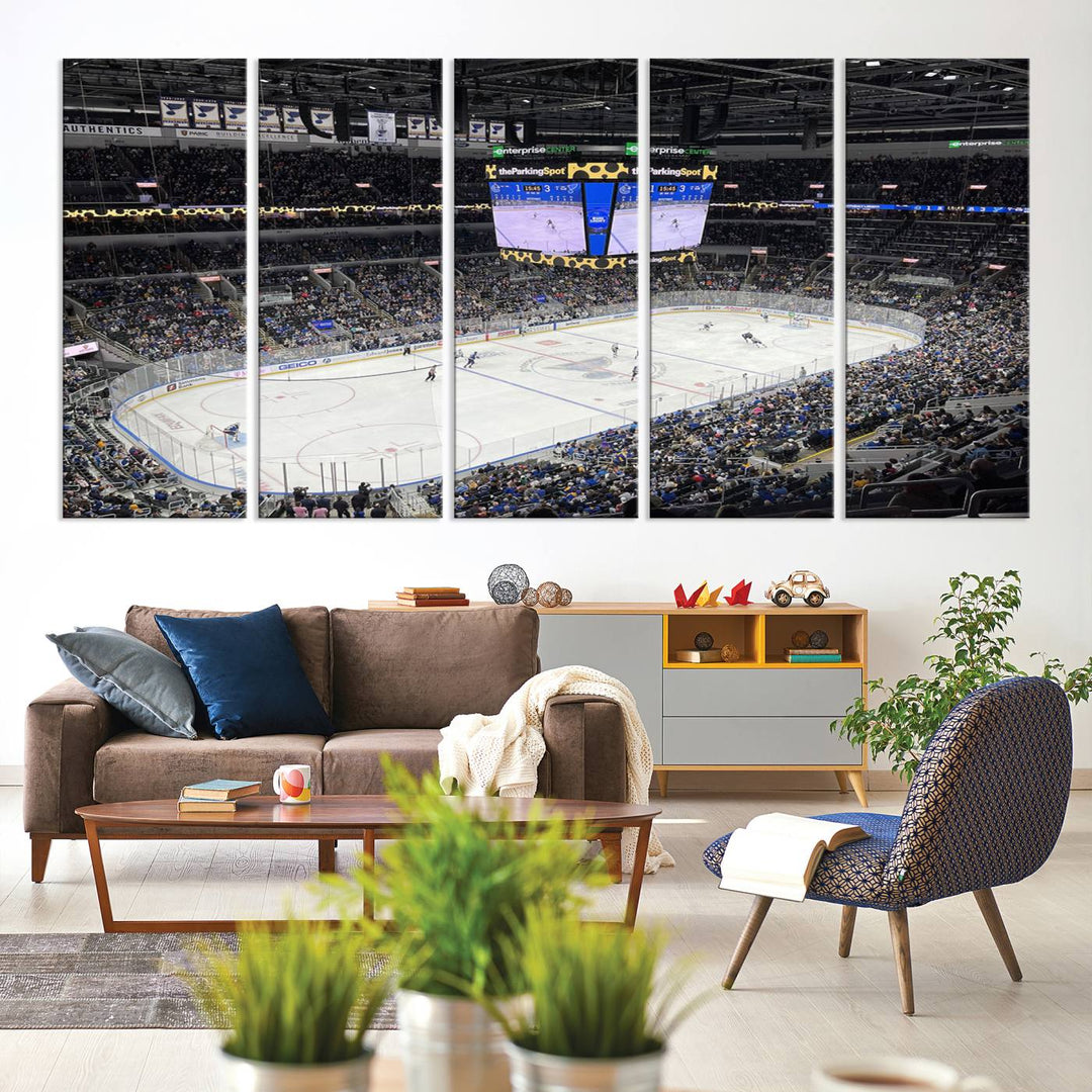 A large Enterprise Center canvas of a crowded hockey arena hangs prominently.