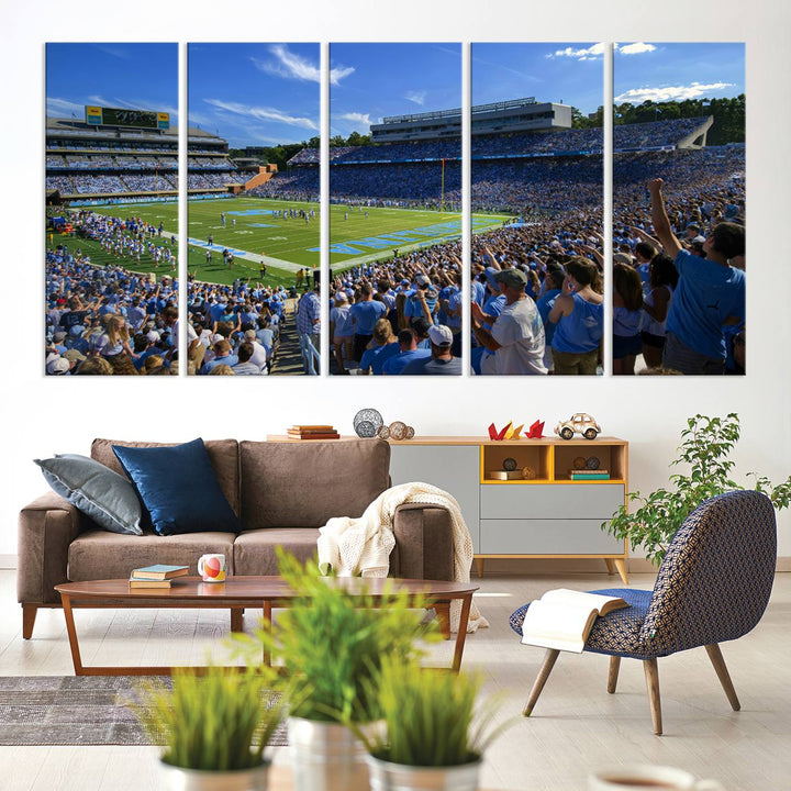 A gallery-quality canvas wall art print featuring the University of North Carolina Tar Heels Football Team and Chapel Hill's Kenan Memorial Stadium adorns the cafe wall.