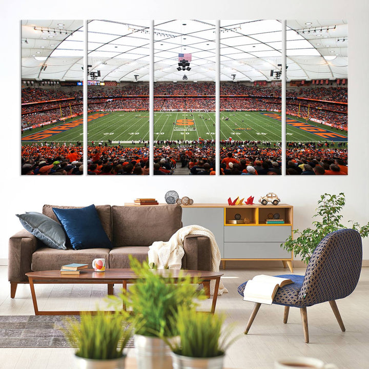 Fans fill the Syracuse JMA Wireless Dome, highlighted in orange and blue under a vaulted roof on this premium canvas print of the scene.