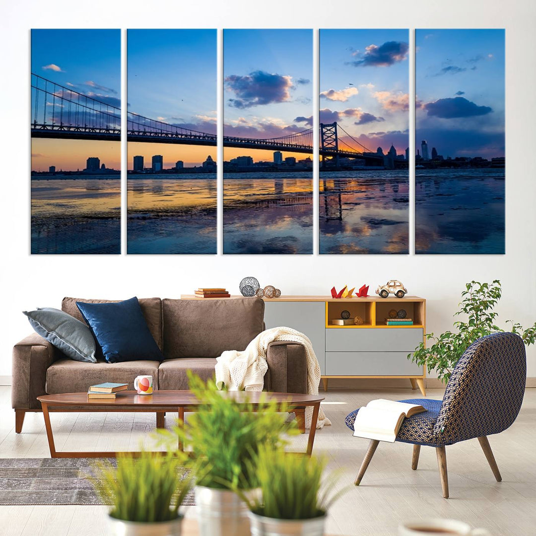 A photograph titled "Large Wall Art Philadelphia Canvas Print - Benjamin Franklin Bridge at Sunset" displays a breathtaking cityscape of the bridge reflected in the water. This image features a gallery-quality finish that promises to transform any space into an evocative memory.