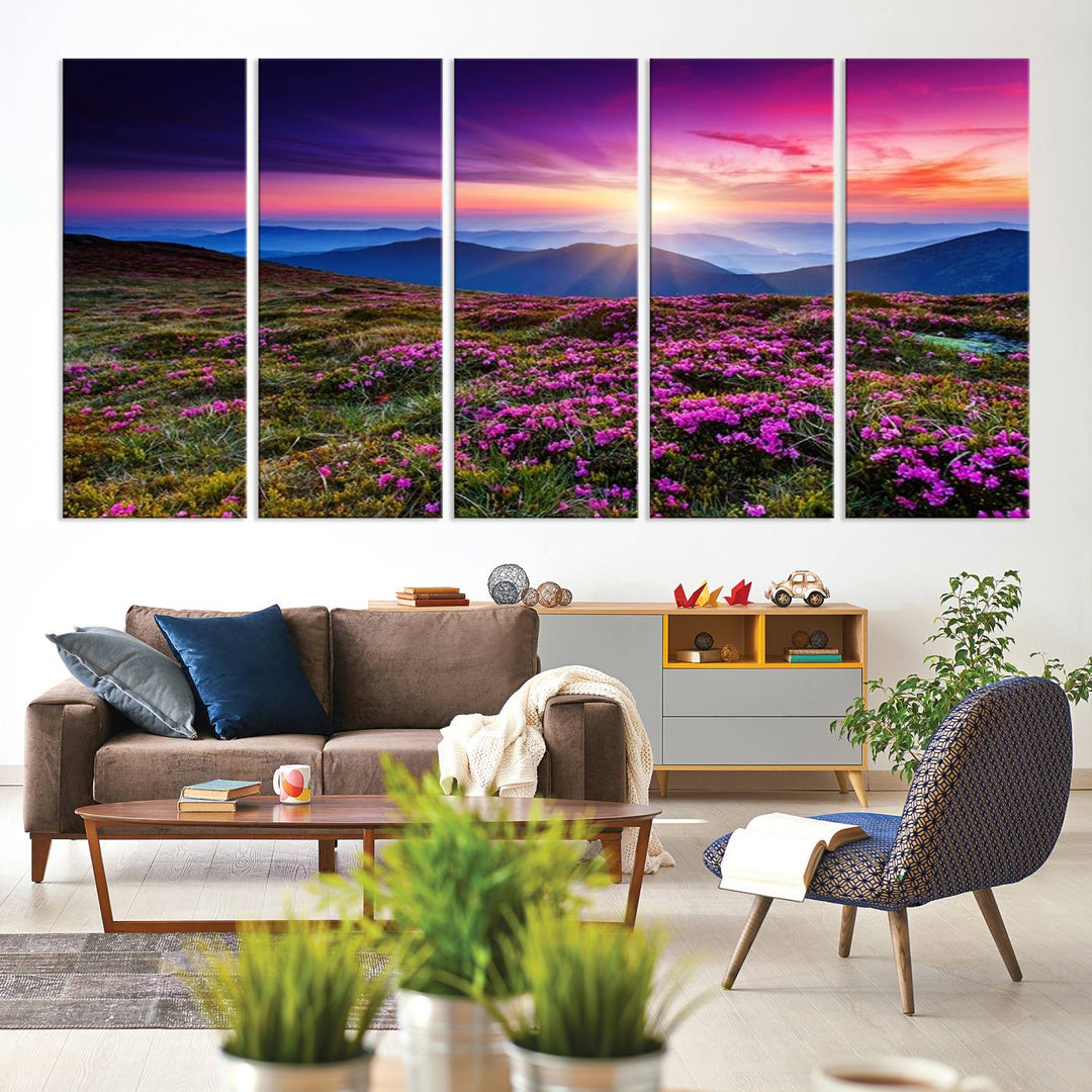 A 3-panel landscape photography canvas of a sunset over mountain meadows with purple wildflowers decorates the wall.