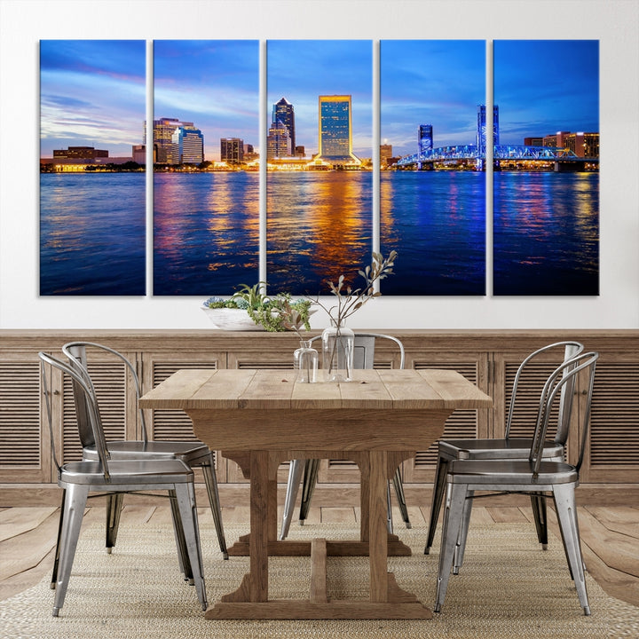 A cozy living room features the Jacksonville Wall Art Canvas Print, a large triptych crafted on museum-quality canvas that beautifully depicts the Jacksonville city skyline at sunset.