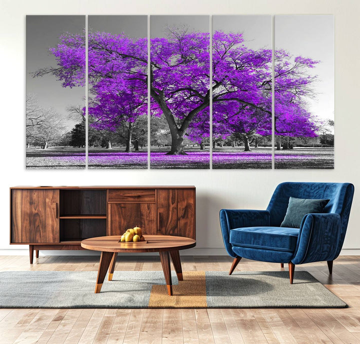 The Big Purple Tree Wall Art Canvas Print showcases a vibrant purple tree set against a black-and-white landscape.