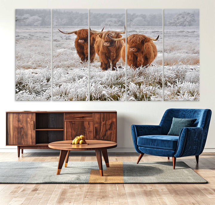 The Highland Cows in Snow canvas showcases three cattle in a frosty field.