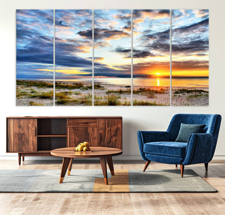 The Sunset On The Ocean canvas wall art features a beautiful beach sunset with grass and clouds.