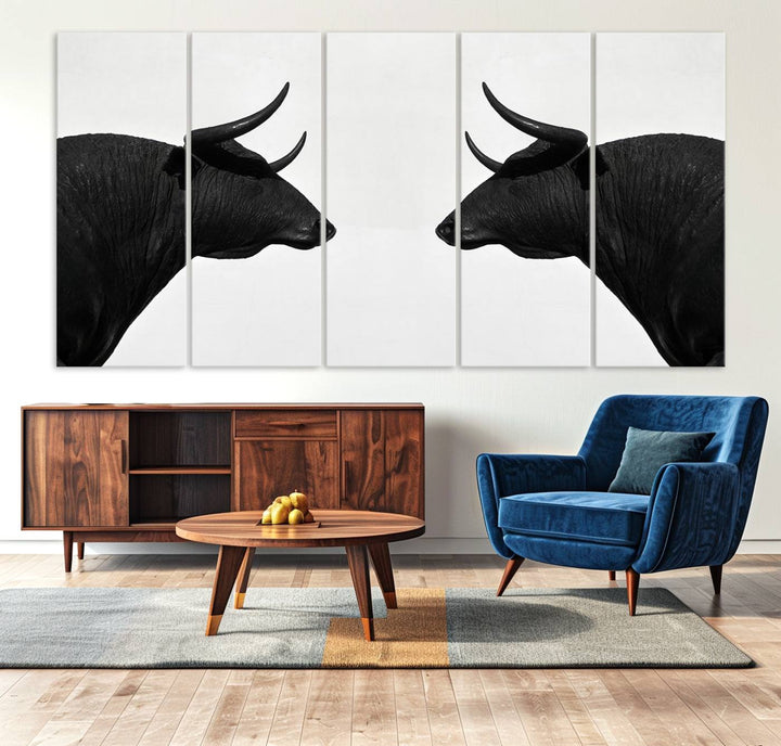 A framed canvas print featuring two black bull silhouettes, perfect for modern rustic decor.