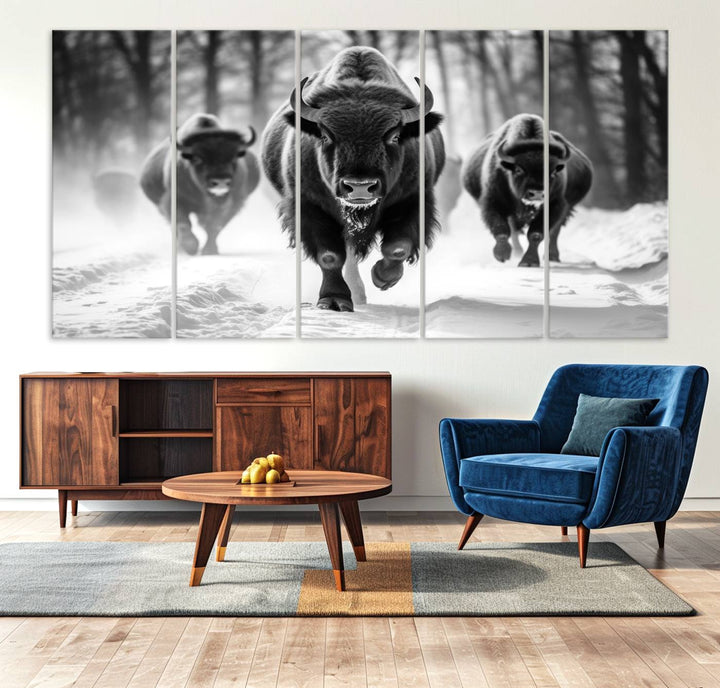 The Buffalo Wall Art Canvas Print of bison running through snow adorns the wall.