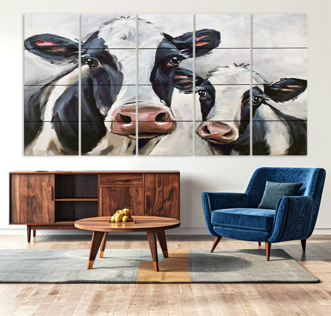 The Vintage Baby and Mom Cattle Canvas, featuring cows with black and white patches, is a prominent piece of wall art.