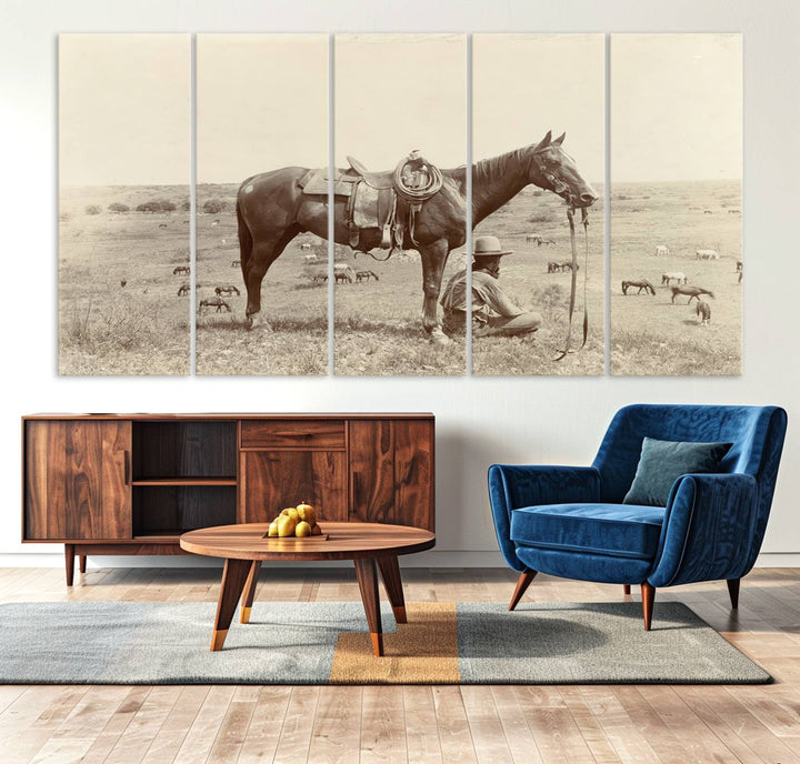 Cowboy Wall Art - Vintage Western Horse Canvas Print features a cowboy kneeling by his horse in a field.