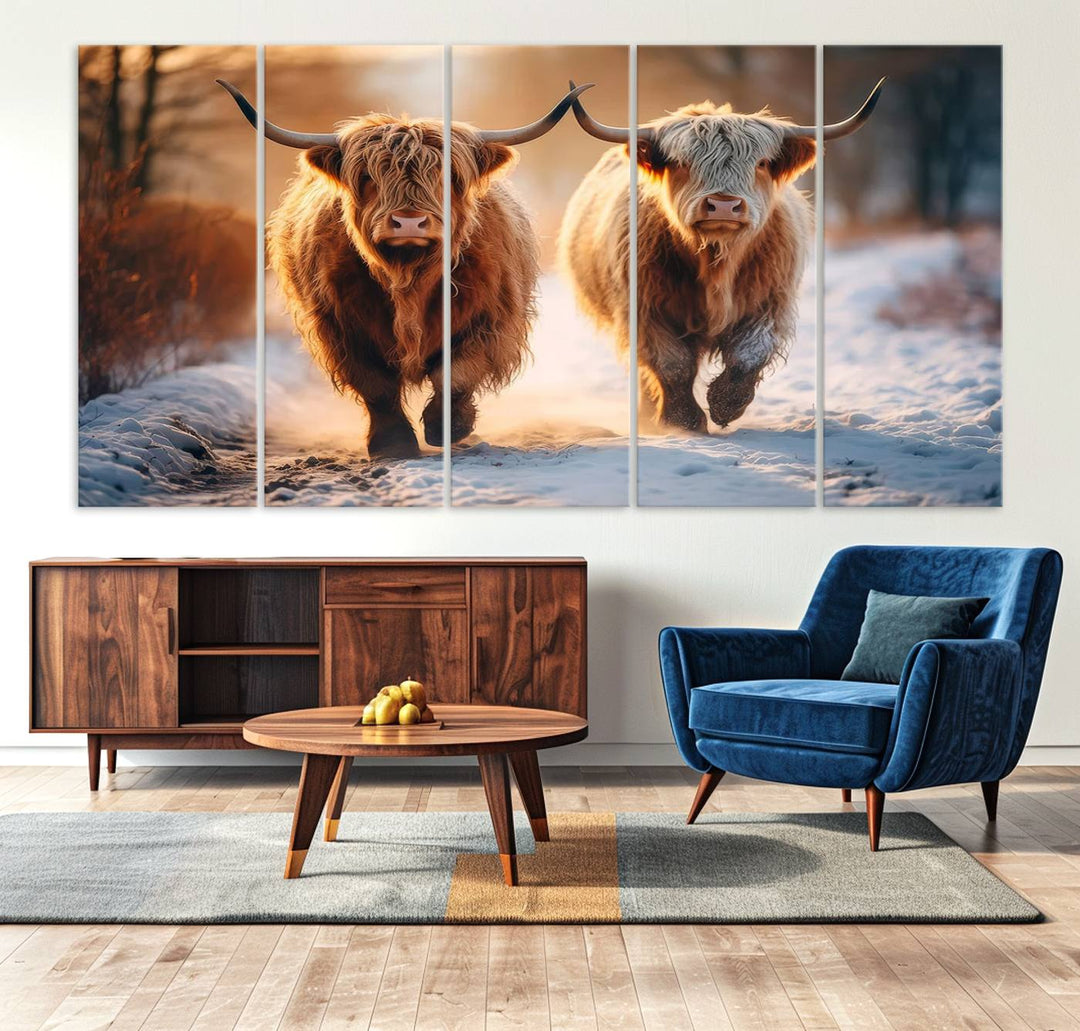 The wall art is a Scottish Highland Cow Horn canvas print featuring cows on a snowy path bathed in warm sunlight, serving as a rustic decor piece.