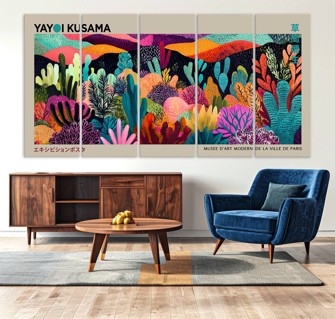 The framed Yayoi Kusama wall art adds vibrancy above the blue couch.