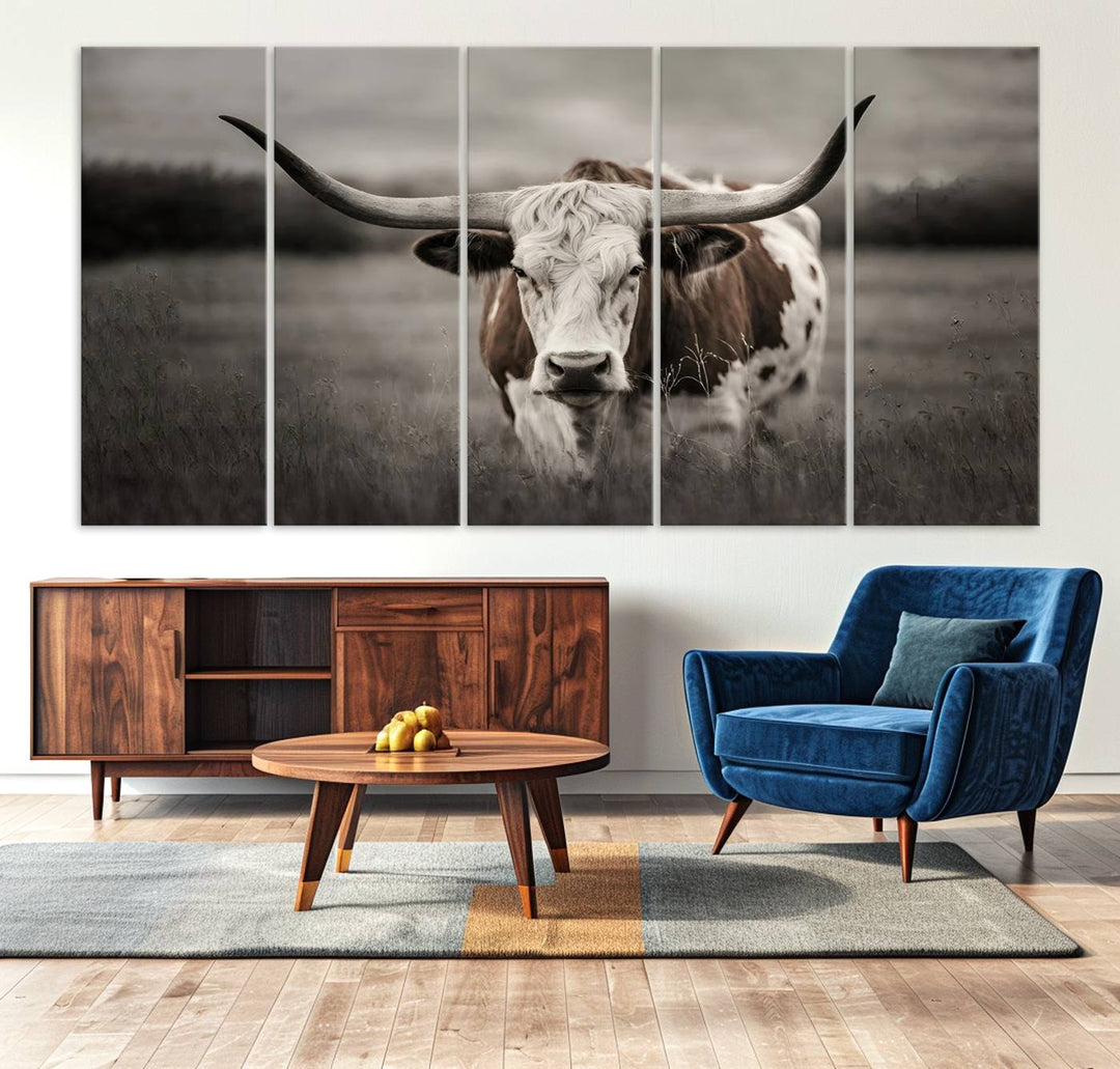 The Texas Longhorn Cow Canvas Wall Art Print adds a rustic touch to a living room.