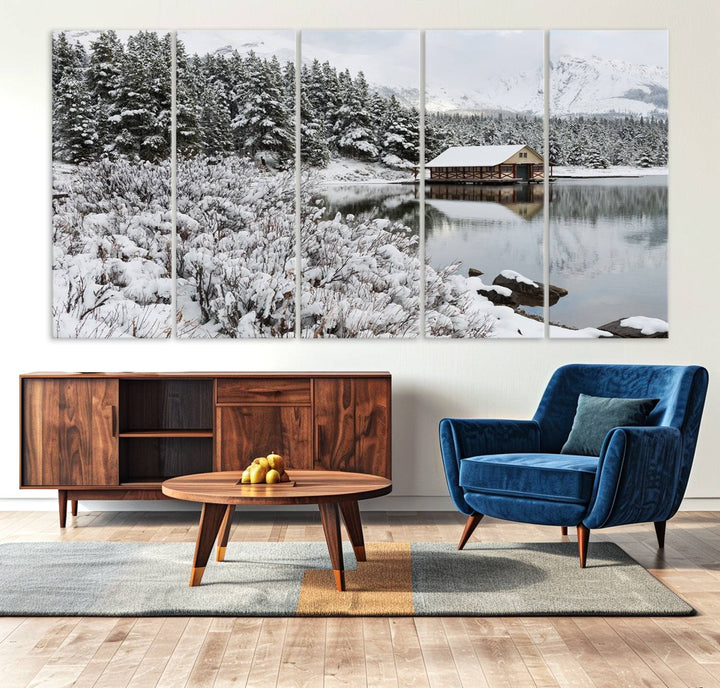 Experience the beauty of winter with the "Cabin by the Lake Canvas Wall Art," showcasing a serene snowy landscape. This rustic nature decor features a cozy cabin nestled amid snow-laden trees, set against a breathtaking mountain view, perfect for enhancing your living room.