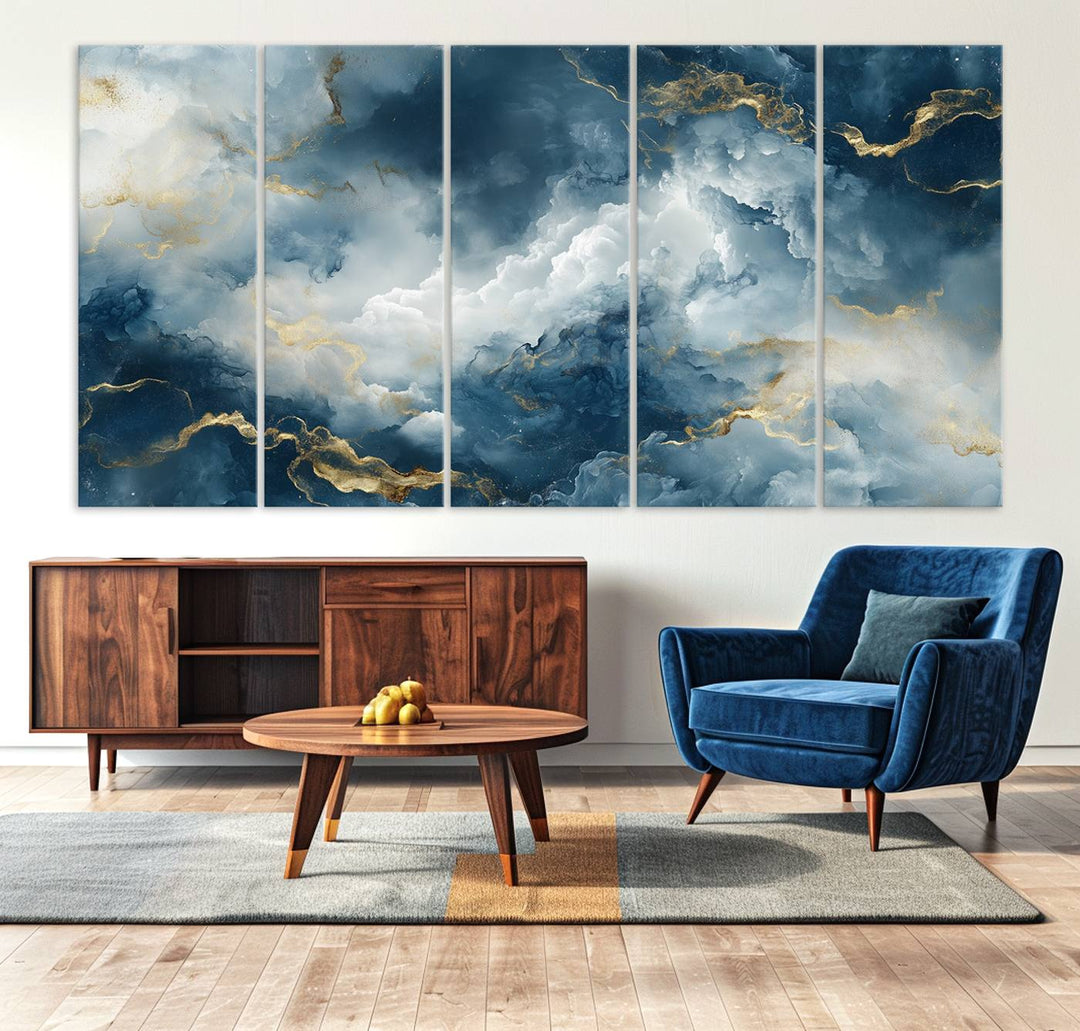 Modern living room featuring the Large Abstract Print - Luxe Blue and Gold Abstract Canvas Wall Art that showcases a bold cloudscape, perfect for modern home decor.