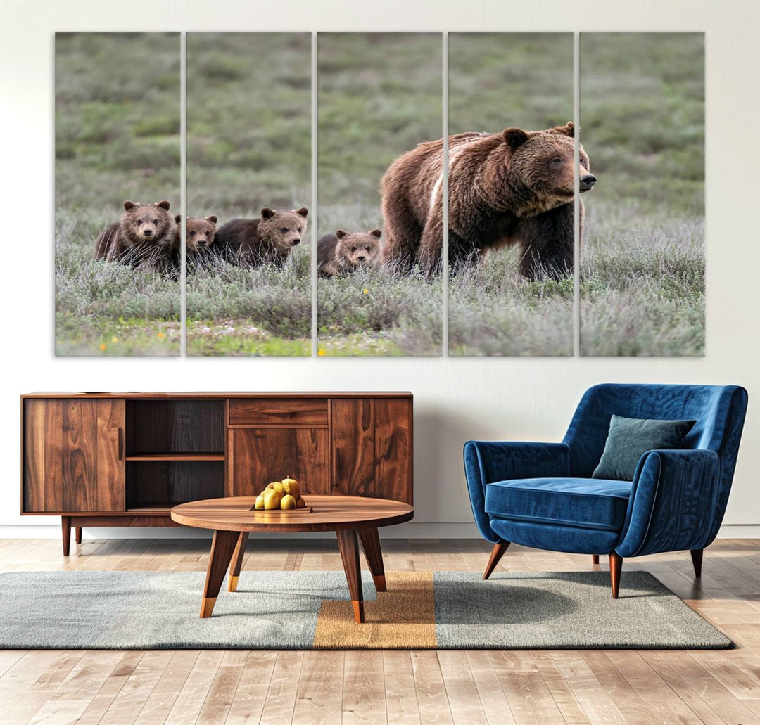 The large canvas print titled "Queen of the Tetons, 399 Grizzly Bear Cubs" showcases majestic wildlife photography of a bear and her cubs walking through the grass. This stunning canvas wall art, handmade in the USA, adds a charming touch to any room with its rustic decor appeal.